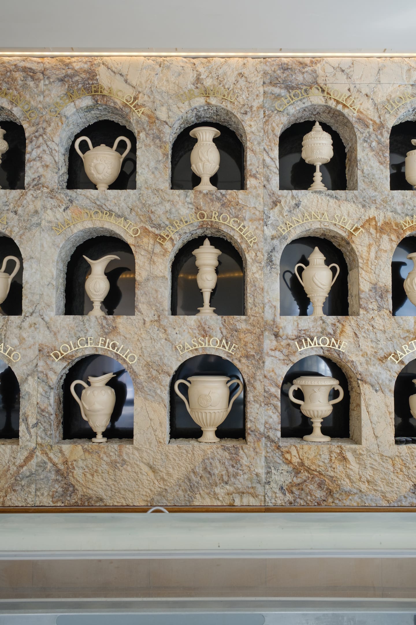 Full stone flavour wall with hand-turned urns set into quartzite